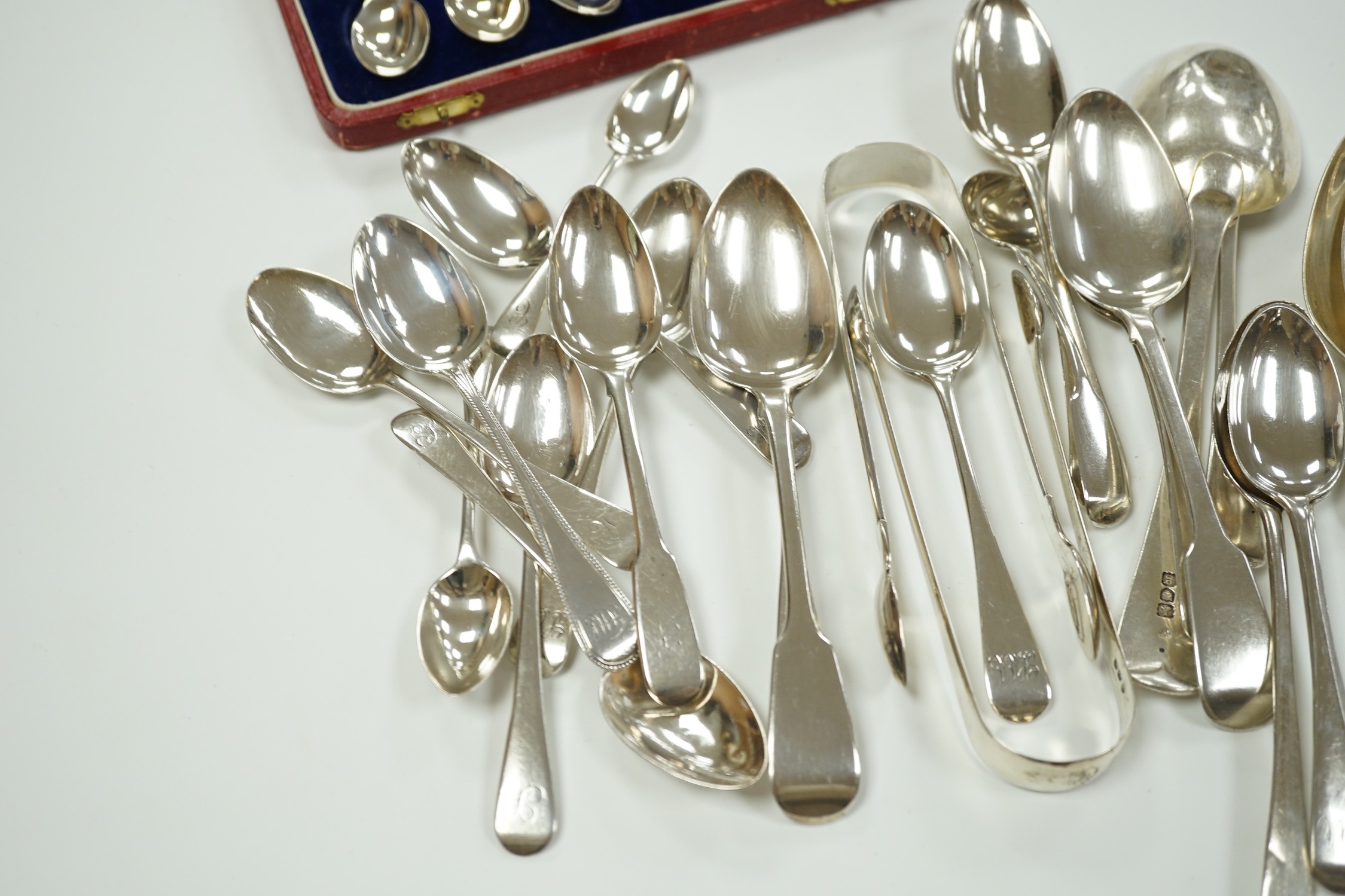 A quantity of assorted mainly 19th century silver flatware, various patterns, dates and makers, including a cased set of six 1937 Coronation silver teaspoons, four pairs of Georgian sugar tongs and a pair of Edwardian si